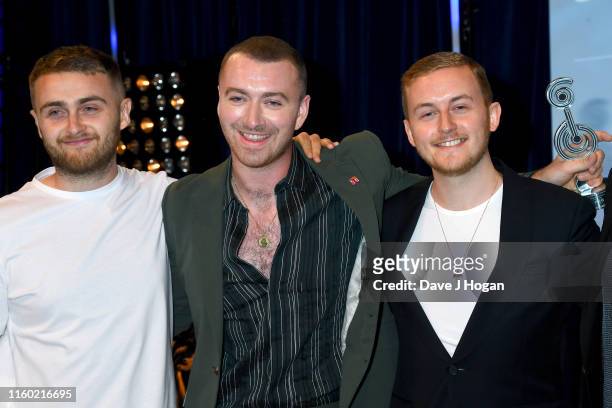 Sam Smith poses with Howard Lawrence and Guy Lawrence of Disclosure after winning Best Male during the Nordoff Robbins O2 Silver Clef Awards 2019 at...
