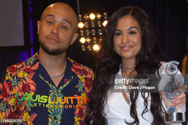Mabel poses with Jax Jones after winning Best Newcomer during the Nordoff Robbins O2 Silver Clef Awards 2019 at Grosvenor House on July 05, 2019 in...