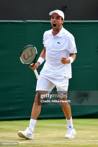 Roberto Bautista Agut of Spain celebrates in his Men's Singles third round match against Karen Khachanov of Russia during Day five of The...