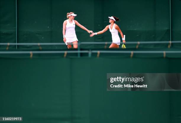 Arina Rodionova of Asutralia and Kateryna Kozlova of Ukraine celebrates in their Ladies' Doubles first round match against Gabriela Dabrowski of...