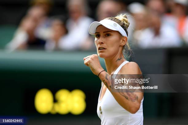 Polona Hercog of Slovenia celebrates winning the first set in her Ladies' Singles third round match against Cori Gauff of The United States during...