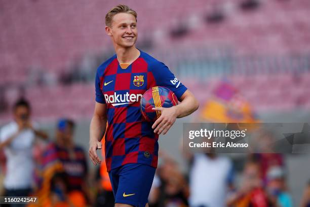 New Barcelona signing Frenkie de Jong walks onto pitch as he is unveiled at Camp Nou stadium on July 05, 2019 in Barcelona, Spain.