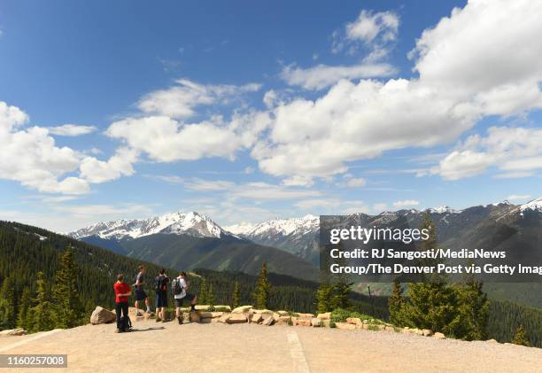 Guest take in the view from Aspen Mountain, at the top of the Silver Queen Gondola, on June 30, 2019 in Aspen, Colorado.