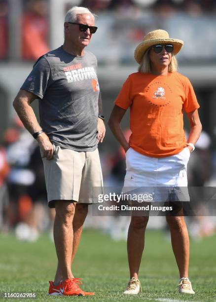 Owners Jimmy and Dee Haslam of the Cleveland Browns watch the action from the sideline during a training camp practice on July 26, 2019 at the...