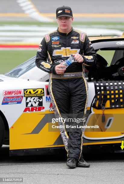 Sheldon Creed, driver of the Chevrolet Accessories Chevrolet, stands on pit road during qualifying for the NASCAR Xfinity Series Circle K Firecracker...