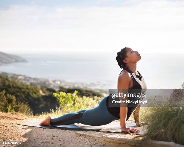 building a strong back and core - sun salutation stock pictures, royalty-free photos & images