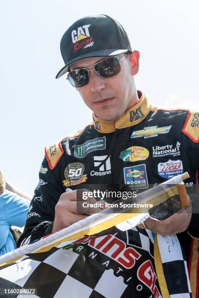 Richard Childress Racing driver Daniel Hemric signs autographs prior to driver introductions of the Monster Energy NASCAR Cup Series, GoBowling at...