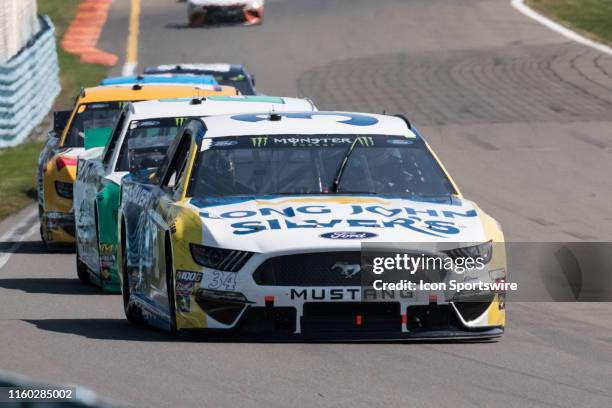 Michael McDowell driver of the Long John Silver's Ford races down the short shoot heading into turn 6 the Monster Energy NASCAR Cup Series, GoBowling...