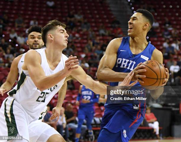 Zhaire Smith of the Philadelphia 76ers drives to the basket against Daulton Hommes the Milwaukee Bucks during the 2019 NBA Summer League at the...