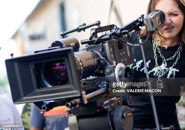 Participant Alyssah Powell works as cinematographer as interns shoot a scene during a session of the Academy Gold Production Track Program at Warner...