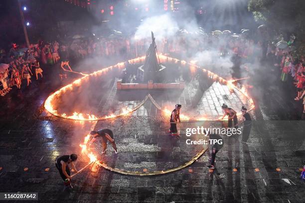 The Tu and Miao people fire the love lock and dance to celebrate the traditional Tanabata festival on 07th August, 2019 in Zhangjiajie,Hunan,China.