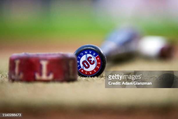 A detailed view of a bat with the Texas Rangers logo on it during the game between the Texas Rangers and the Minnesota Twins at Target Field on...