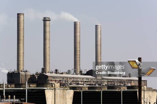 Emissions rise from towers at the Sasol Ltd. Sasol One Site in Sasolburg, South Africa, on Wednesday, Aug. 7, 2019. Sasol said some of its South...