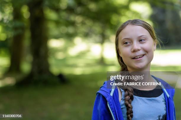 Swedish climate activist Greta Thunberg looks on during a meeting with Intergovernmental Panel on Climate Change representatives after the launch of...