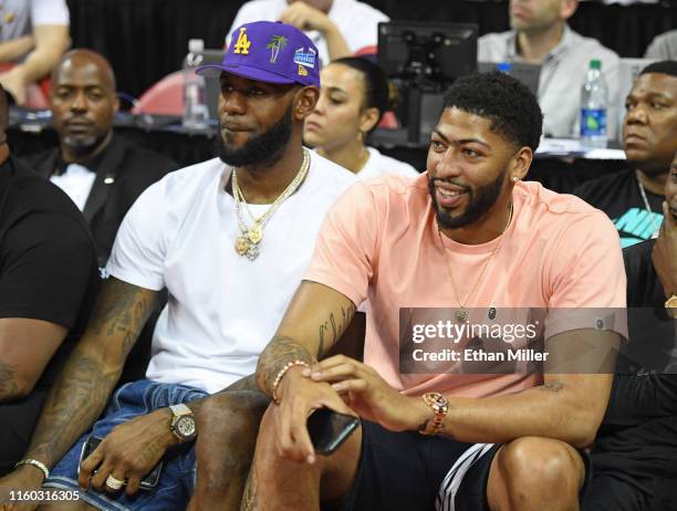 Players LeBron James and Anthony Davis watch a game between the New Orleans Pelicans and the New York Knicks during the 2019 NBA Summer League at the...