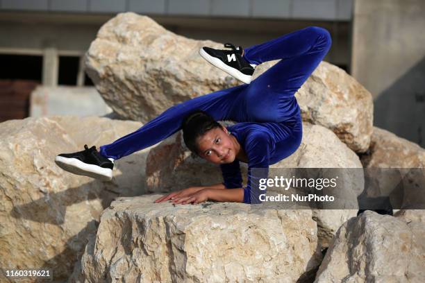 Palestinian girl Areej Ayoub, 11 years, hopes to break the Guinness world records with his bizarre feats of contortion, demonstrates acrobatics...