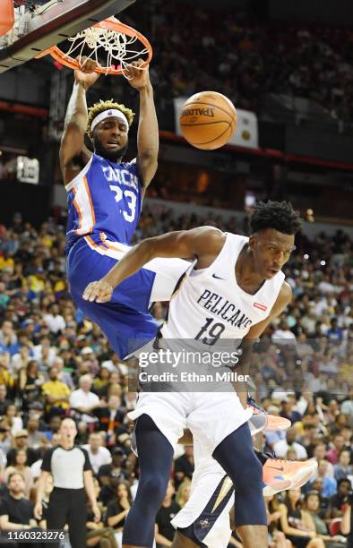 Mitchell Robinson of the New York Knicks dunks against Kavell Bigby-Williams of the New Orleans Pelicans during the 2019 NBA Summer League at the...