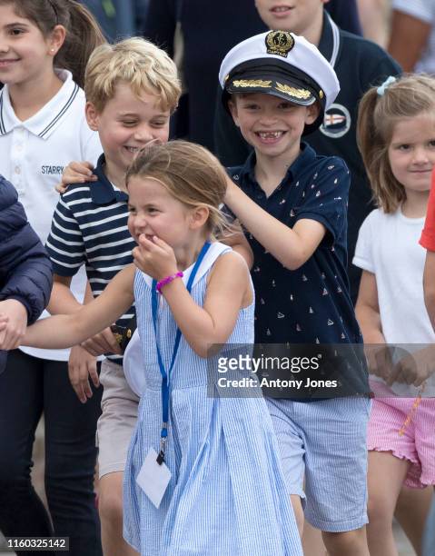 Prince George with Princess Charlotte at The Royal Yacht Squadron during the inaugural Kings Cup regatta hosted by the Duke and Duchess of Cambridge...