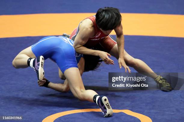 Kaori Icho competes against Risako Kawai in the Women's 57kg play-off match during the Wrestling World Championships Japan Play-offs at Wako Sports...