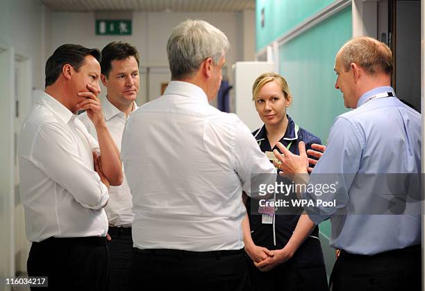 Prime Minister David Cameron , Health Secretary Andrew Lansley and Deputy Prime Minister Nick Clegg meet nurses and doctors at Guy's Hospital on June...