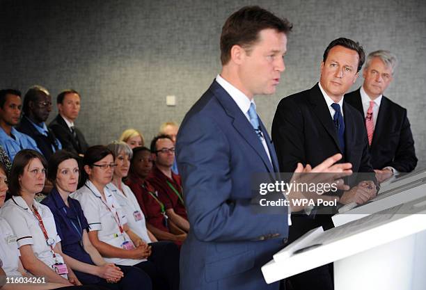 Prime Minister David Cameron and Health Secretary Andrew Lansley watch Deputy Prime Minister Nick Clegg address hospital staff and media at Guy's...