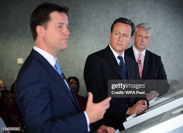 Prime Minister David Cameron and Health Secretary Andrew Lansley watch Deputy Prime Minister Nick Clegg address hospital staff and media at Guy's...