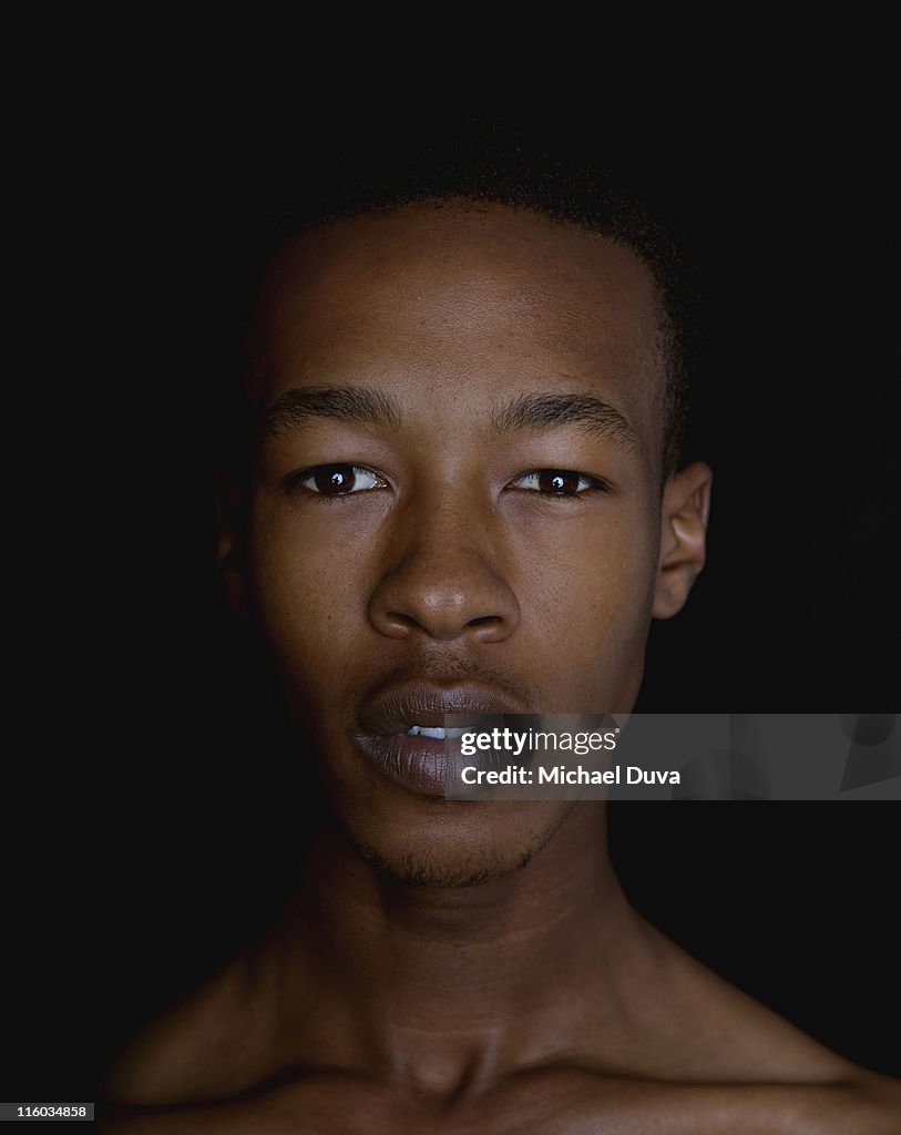 Young African American Male on black background