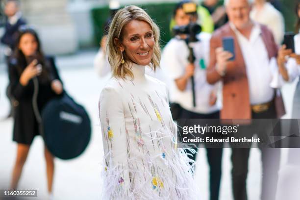 Celine Dion wears a white fluffy dress with turtleneck, outside Valentino, during Paris Fashion Week -Haute Couture Fall/Winter 2019/2020, on July...