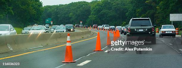 roadwork on the highway - traffic cone stock pictures, royalty-free photos & images