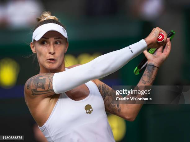 Polona Hercog of Slovenia in action during her match against Cori Gauff of USA on Day Five of The Championships - Wimbledon 2019 at All England Lawn...