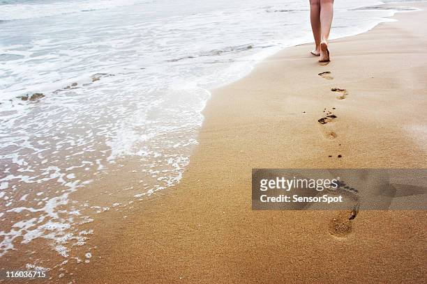 walking on the sand - footprint stock pictures, royalty-free photos & images