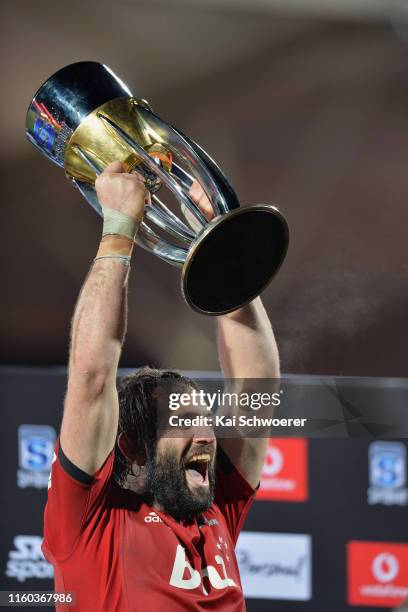 Captain Samuel Whitelock of the Crusaders lifts the Super Rugby trophy after winning the Super Rugby Final between the Crusaders and the Jaguares at...