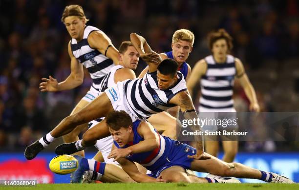 Tim Kelly of the Cats and Josh Dunkley of the Bulldogs compete for the ball during the round 16 AFL match between the Western Bulldogs and the...