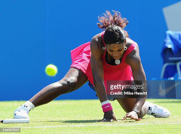 Serena Williams of USA slips in her match against Tsventana Pironkova of Bulgaria during day four of the AEGON International at Devonshire Park on...