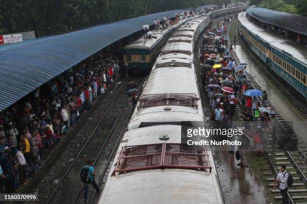 People seen leaving for their hometowns for the upcoming festival Eid-Ul-Adha at the airport railway station in Dhaka, Bangladesh on 08 Aug 2019.