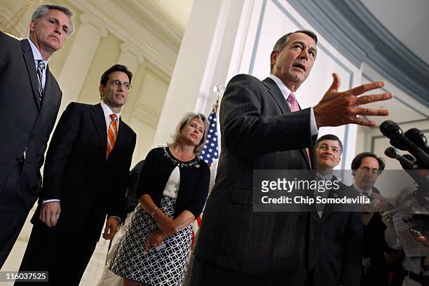 Speaker of the House John Boehner talks to reporters after a closed Republican caucus meeting with U.S. Rep. Kevin McCarthy , House Majority Leader...