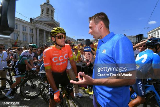 Start / Greg Van Avermaet of Belgium and CCC Team / Jens Voigt of Germany Ex-pro cyclist TV commentator / Place Royal / Brussels City / during the...