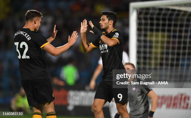 Raul Jimenez of Wolverhampton Wanderers celebrates after scoring a goal to make it 0-3 with Leander Dendoncker of Wolverhampton Wanderers during the...