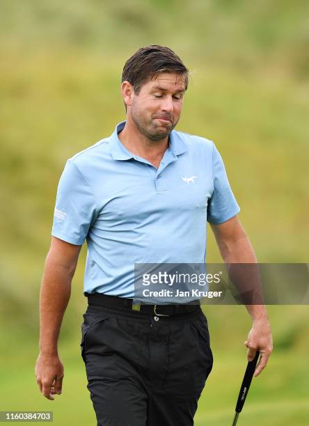 Robert Rock of England reacts to his birdie putt on the sixteenth hole during Day Three of the Dubai Duty Free Irish Open at Lahinch Golf Club on...