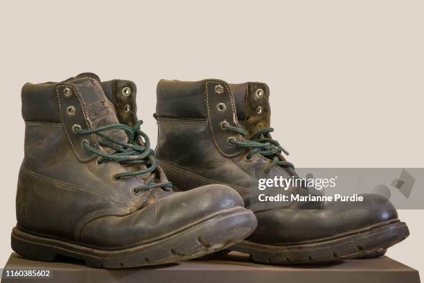 old boots - work boot stock pictures, royalty-free photos & images