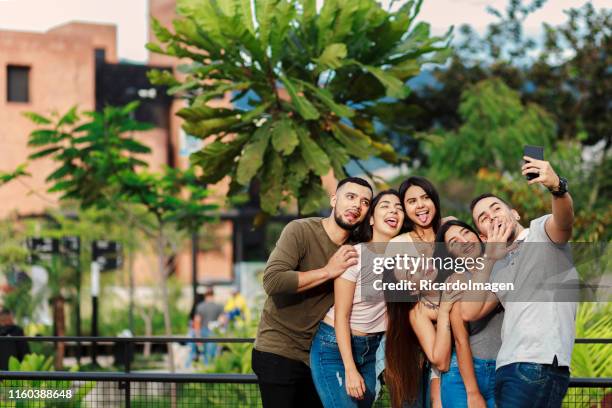 teenagers taking a selfie - latin script stock pictures, royalty-free photos & images