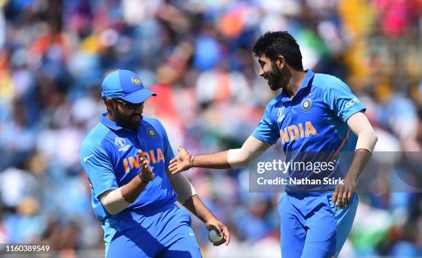 Jasprit Bumrah high fives Rohit Sharma of India after he gets Angelo Matthews of Sri Lanka out during the Group Stage match of the ICC Cricket World...