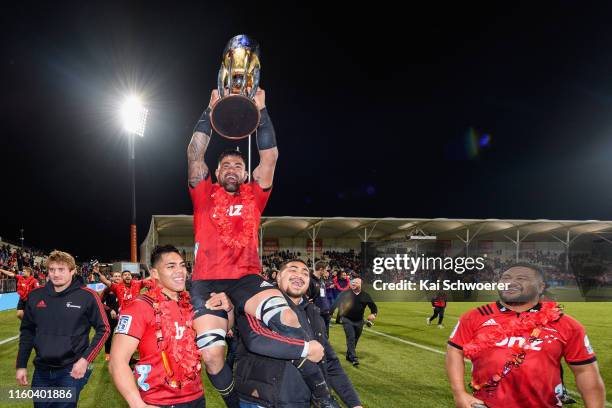 Jordan Taufua of the Crusaders lifts the Super Rugby trophy after winning the Super Rugby Final between the Crusaders and the Jaguares at...