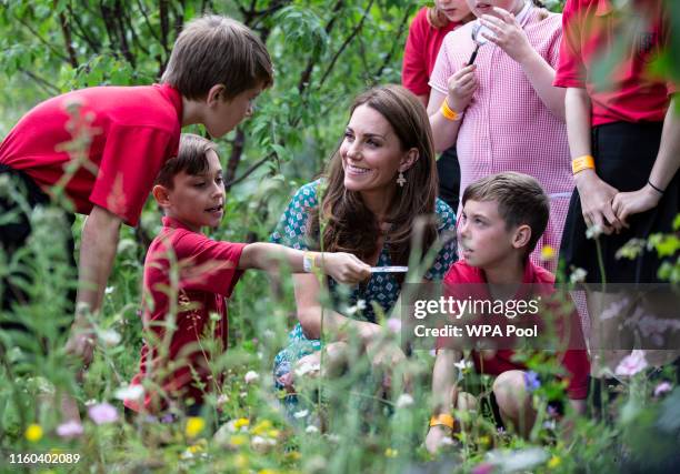 Catherine, Duchess of Cambridge visits the Hampton Court Flower Festival with children from Hampton Hill junior school at Hampton Court Palace on...