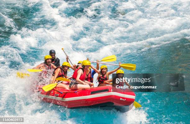 group of people white water rafting - white water rafting stock pictures, royalty-free photos & images