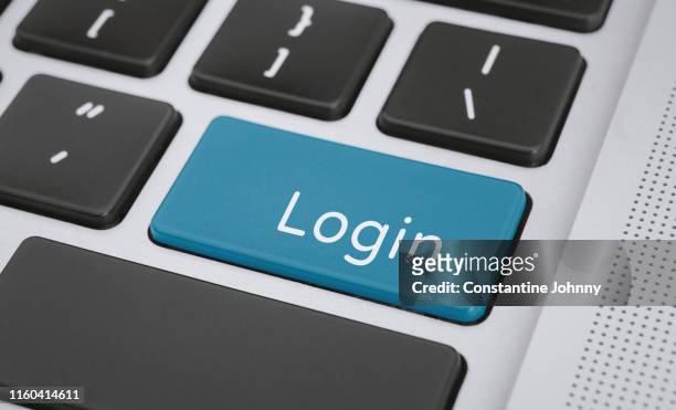 login word on computer keyboard keys - login stockfoto's en -beelden