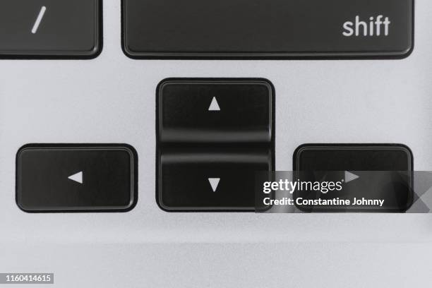 close up of computer keyboard arrow keys - keyboard-arrow-keys stock pictures, royalty-free photos & images