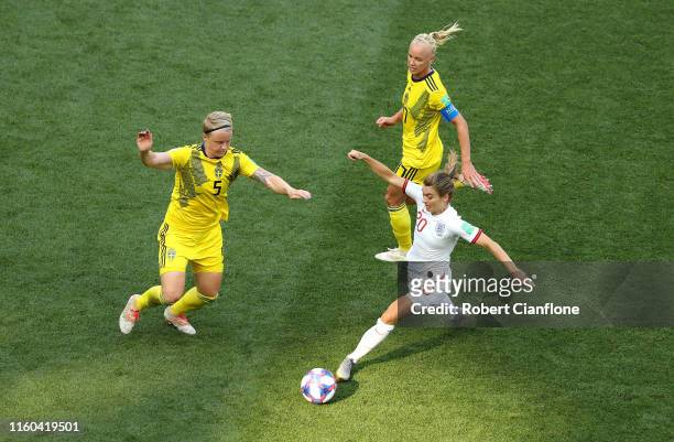 Karen Carney of England runs with the ball under pressure from Nilla Fischer of Sweden during the 2019 FIFA Women's World Cup France 3rd Place Match...