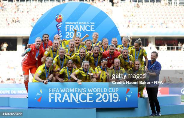 Sweden players celebrate with their 3rd place medals following their sides victory in the 2019 FIFA Women's World Cup France 3rd Place Match match...