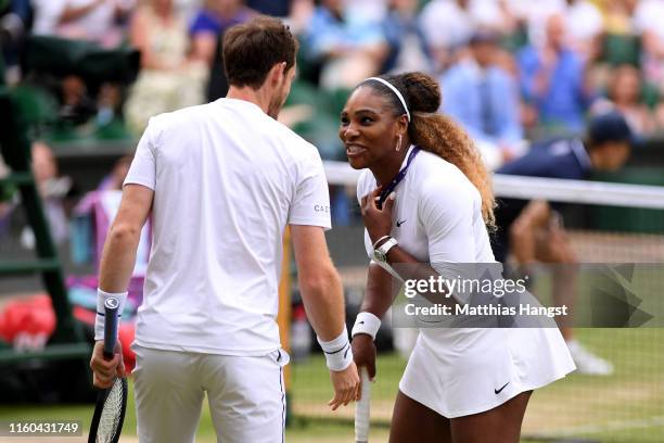 Andy Murray of Great Britain and Serena Williams of The United States react during their Mixed Doubles first round match against Andreas Mies of...